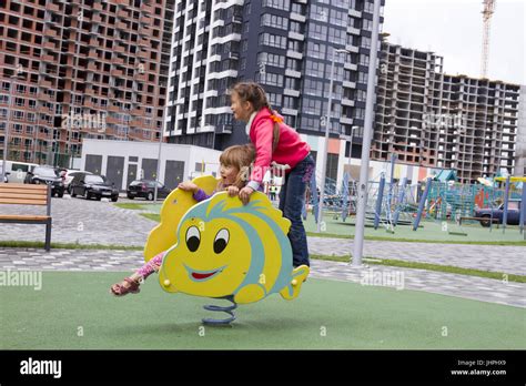 Happy children playing outdoors Stock Photo - Alamy