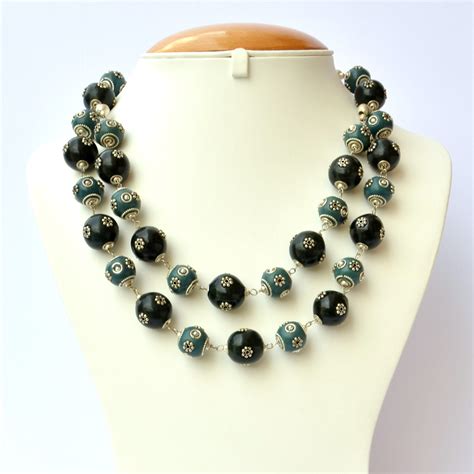 Handmade Necklace with Blue & Black Beads having Metal Flowers | Maruti ...