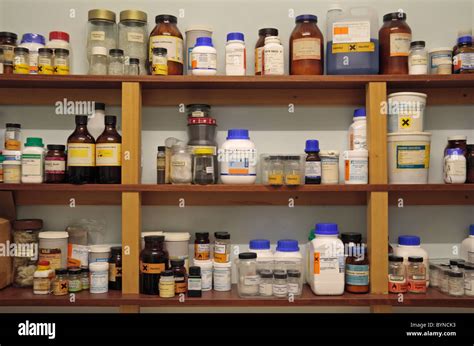 Shelves of assorted chemicals in a school chemical storage room in ...