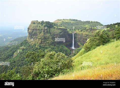 Kumbhe waterfall in monsoon season. Waterfall flowing through mountains in green valley Stock ...