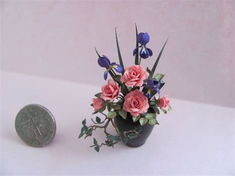 A miniature flower arrangement | Miniature flowers I make ... | Floral art arrangements, Small ...
