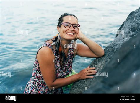 woman with a flirtatious smile Stock Photo - Alamy