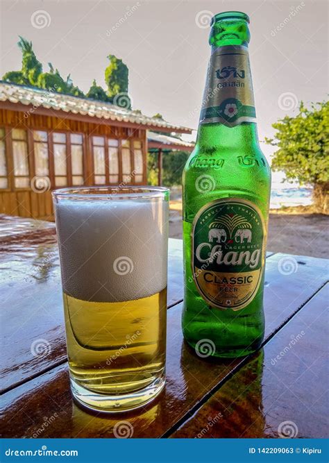 Chang Beer Bottle and Glass Full of Beer on the Table Editorial Stock ...