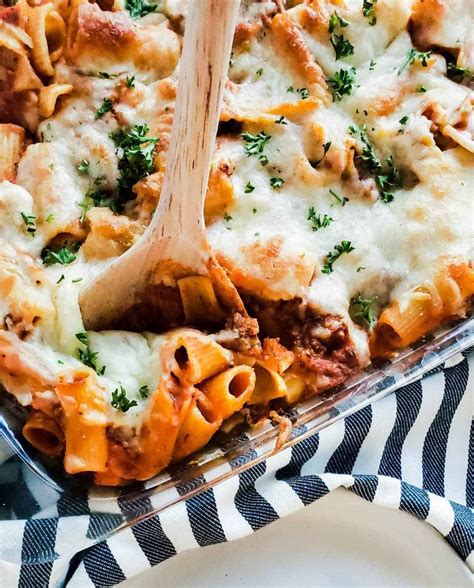 Image for Classic Baked Mostaccioli recipe. The image shows the pasta in a glass baking dish ...