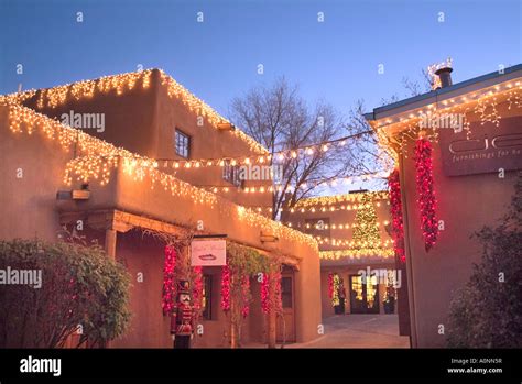 Christmas lights on retail adobe building in Santa Fe New Mexico Stock Photo - Alamy