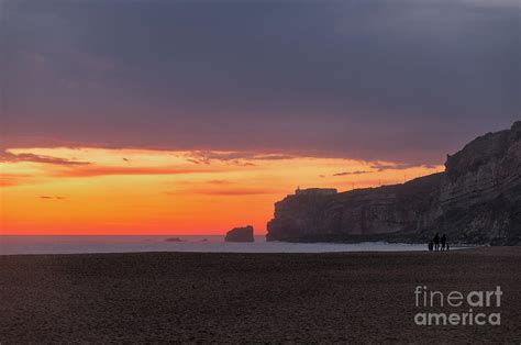 Nazare Beach welcoming Twilight Photograph by Angelo DeVal - Pixels