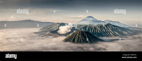 Sunrise over mount Gunung Bromo while the valley stays covered by fog ...