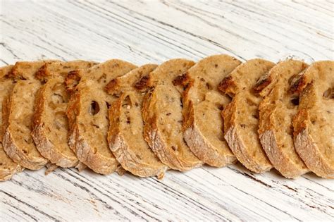 Premium Photo | French bread baguette on cutting board with its slices