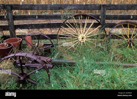 Old wagon wheels with farm equipment Stock Photo - Alamy