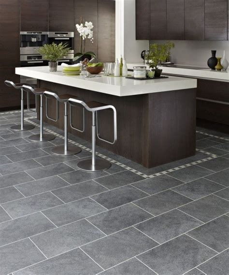 Kitchen with dark cabinets, gray floor and white caulking. | Grey ...