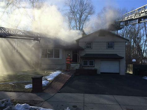 Milford firefighters douse house fire