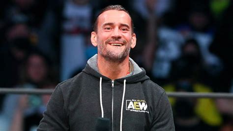 AEW star CM Punk poses with 'trans rights are human rights' sign at All ...