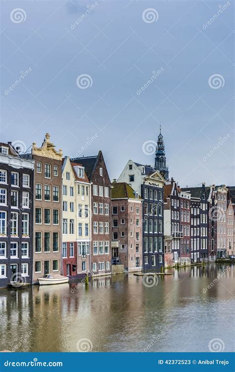 The Damrak Canal in Amsterdam, Netherlands. Stock Image - Image of ...