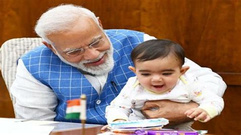 Prime Minister Narendra Modi playing with baby in Parliament photos ...