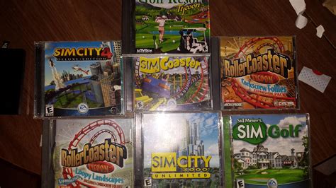 7 pc cd rom games circa 2000 sim and golf with their cases and manuals ...