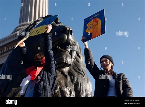 Two female protestors holding signs, protest against Russia's invasion ...