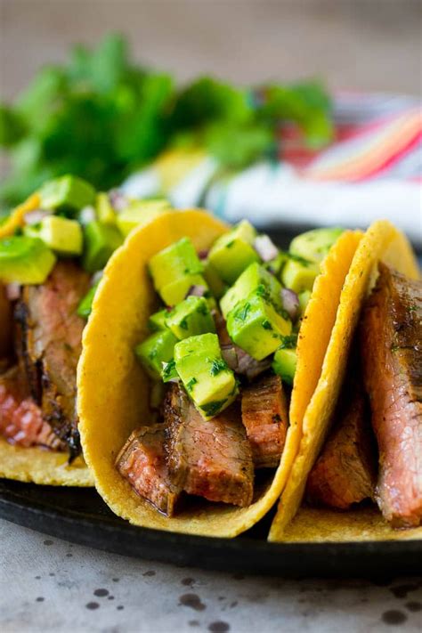 Steak tacos topped with avocado, red onion and cilantro. | Dinner recipes, Steak taco recipe ...