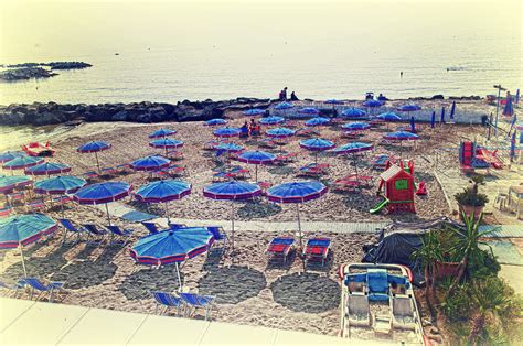 Italy, Sanremo, the beach. Photograph by Adriano Bussi - Fine Art America