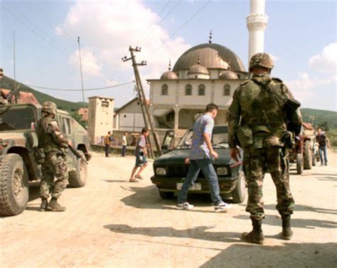 MPs from the 630th Military Police Company man a checkpoint near Vitina, Kosovo.