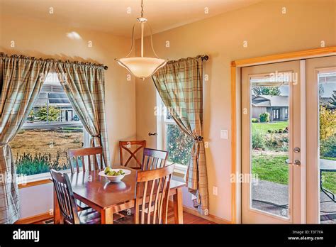 Table and windows in dining room Stock Photo - Alamy