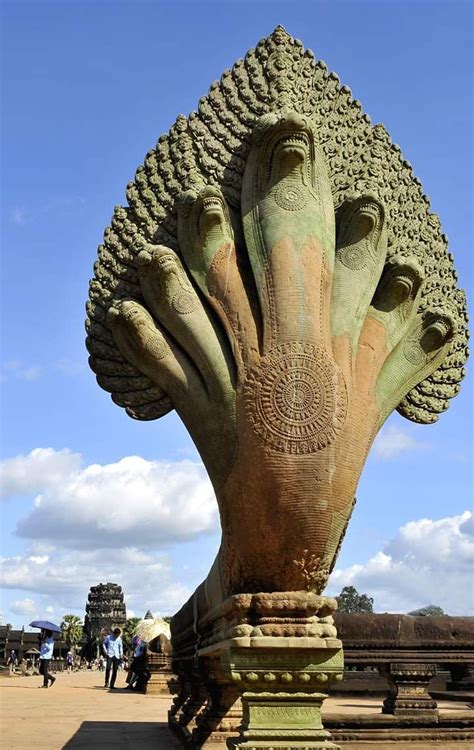 The 7-headed Naga at the entrance of the Angkor Wat Temple I Cambodia. Built by the Hindu King ...