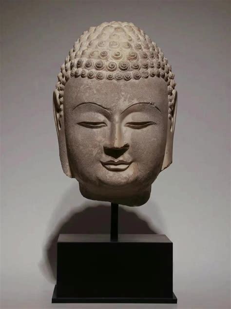 White marble Buddha head - iNEWS