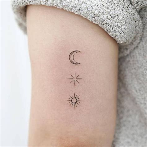 Sun, moon and star tattoo located on the tricep, | Sun tattoos, Star tattoos, Moon star tattoo