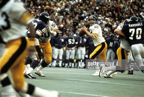 Hall of Fame quarterback Terry Bradshaw of the Pittsburgh Steelers looks for an open receiver ...