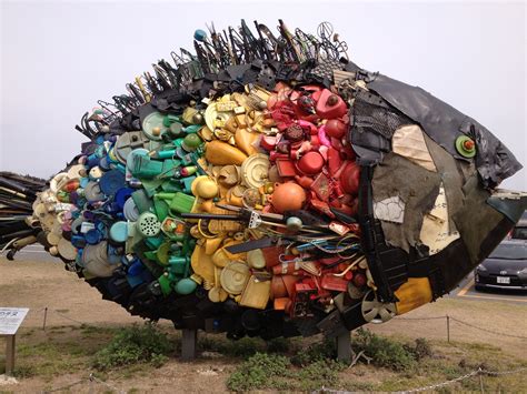 A fish sculpture made entirely out of recycled household material ...