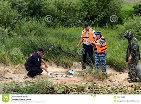 Police Officers Take Out Fish from a Fisherman for Poaching on the Oka River. Editorial Stock ...