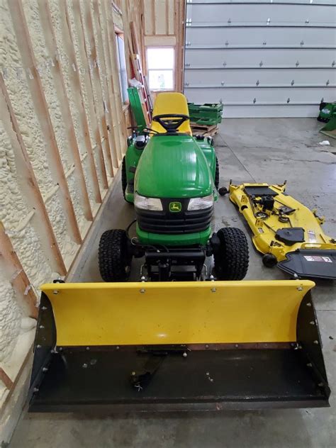 John Deere X585 4x4 Garden Tractor & Attachments - ReGreen Equipment