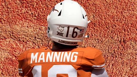 a football player wearing an orange and white uniform with the number ...