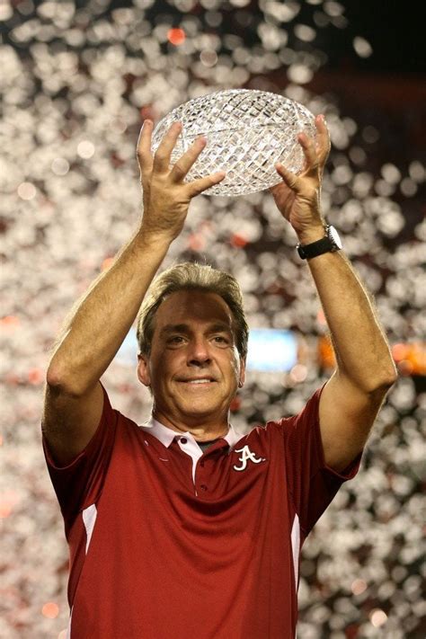 PsBattle: Nick Saban holding the AFCA Championship trophy ...