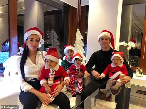 Cristiano Ronaldo and his fiancée Georgina Rodriguez don Santa hats for festive family snap ...