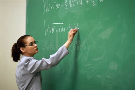 Young Teacher Writing On The Board Stock Image - Image of professor, building: 4831805