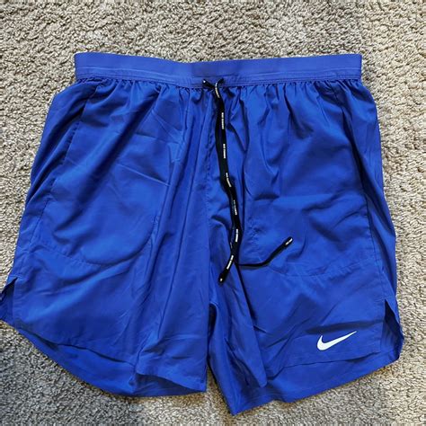 Blue Nike lined running shorts Size L - Depop