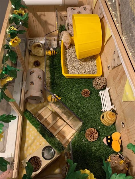 a toy house with lots of animals and plants in the yard, including an ...