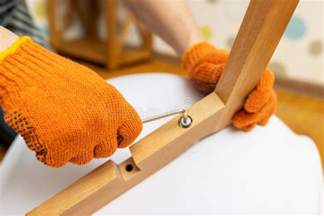 Self-assembly Furniture Concept. the Young Man Himself Assembling Chairs Stock Photo - Image of ...