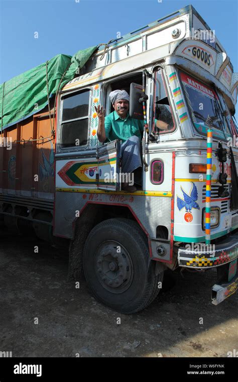 Truck driver driving a truck Stock Photo - Alamy