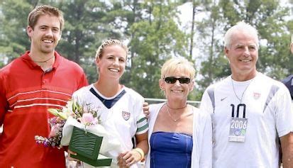 Aly Wagner #10, USWNT, with her future husband, Adam Eyre, on the left, and her parents, Nikki ...