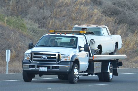 Securing The Car On A Flatbed Tow Truck - Timber Towing And Recovery