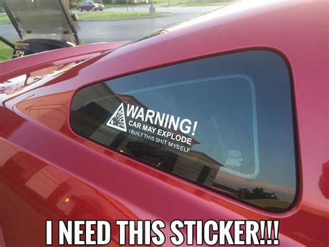 a sticker on the side of a red car that says warning i need this sticker