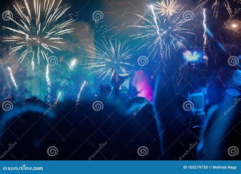 New Year Concept - Cheering Crowd and Fireworks Stock Photo - Image of fireworks, event: 105279750