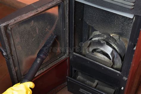 Clean the Pellet Stove with a Vacuum Cleaner Stock Photo - Image of renewable, flame: 236982736