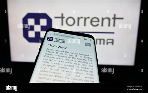 Mobile phone with website of Indian company Torrent Pharmaceuticals Limited in front of business ...