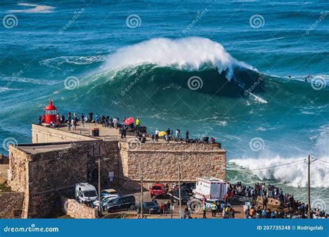 Nazare, Portugal, Surfer Riding Giant Wave in Front of Nazare Lighthouse Editorial Stock Photo ...