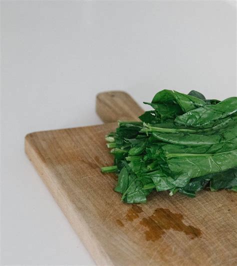 Download Spinach On Wooden Board Wallpaper | Wallpapers.com