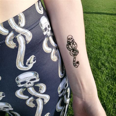 skull and snake tattoo harry potter - Yuonne Elam