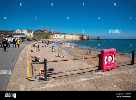 Freshwater Bay, Isle of Wight, UK.2021. Holidaymakers on the beach at ...