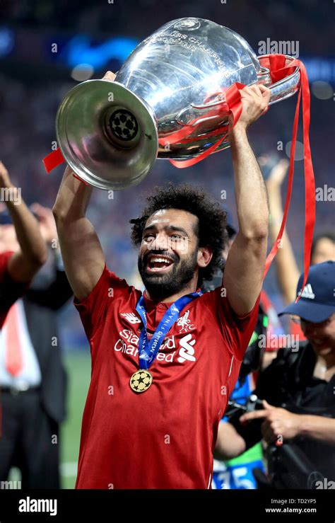 Liverpool's Mohamed Salah celebrates with the trophy after the UEFA Champions League Final at ...